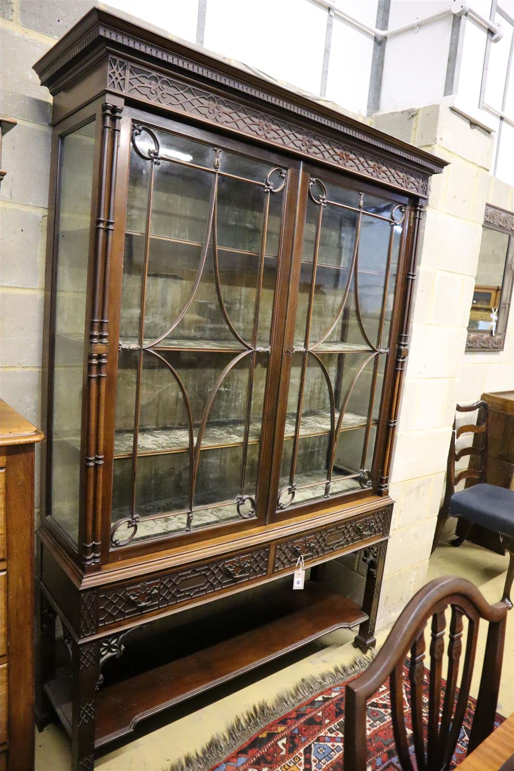 A Chippendale Revival mahogany display cabinet, width 126cm, depth 36cm, height 195cm